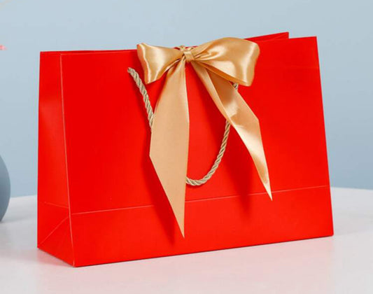 Red bow bag with gold ribbon